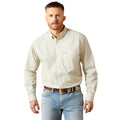 Man wearing a patterned shirt and jeans on a white background