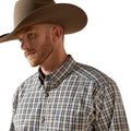Man wearing a cowboy hat and plaid shirt on a white background