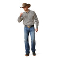 Man wearing a plaid shirt, jeans, and a cowboy hat on a white background