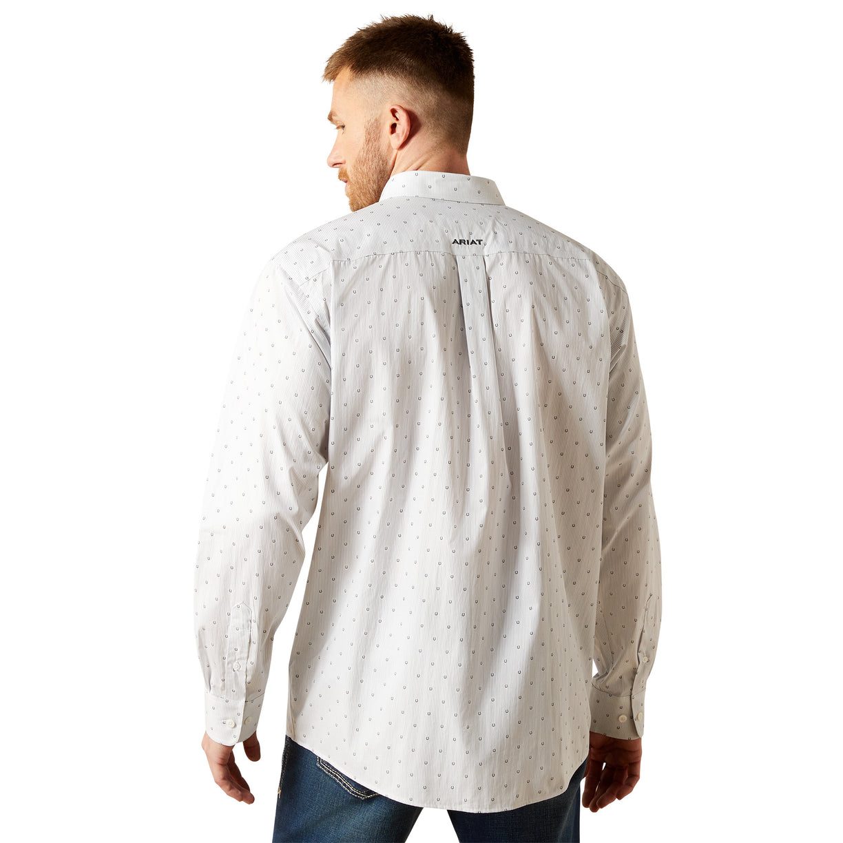 Man wearing a light gray patterned shirt with a brand logo on the back, standing against a white background.