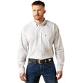 Man wearing a light gray patterned shirt and blue jeans on a white background