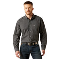 Man wearing a checkered shirt and jeans on a white background