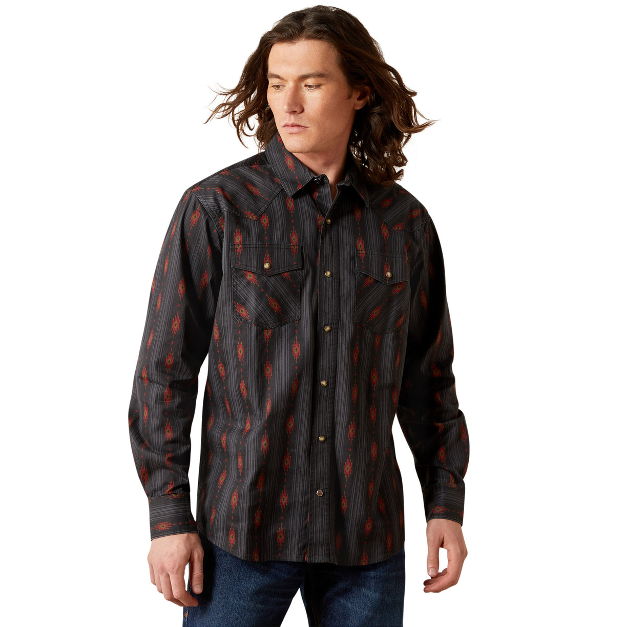 Man wearing a patterned shirt on a white background