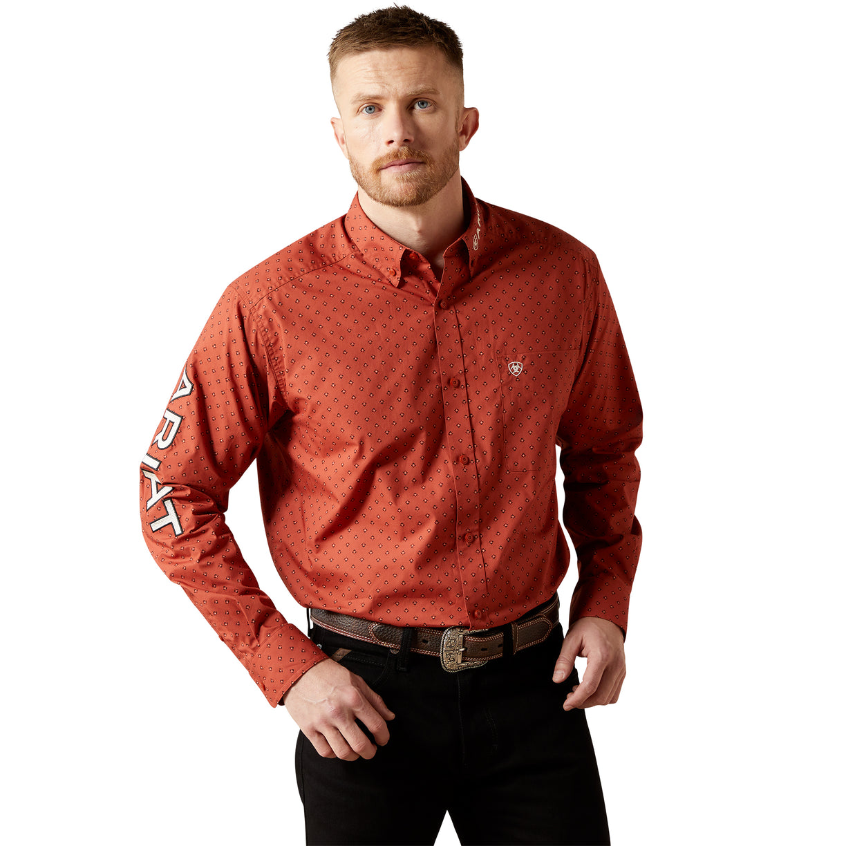 Man wearing a red patterned shirt with text on sleeves against a white background