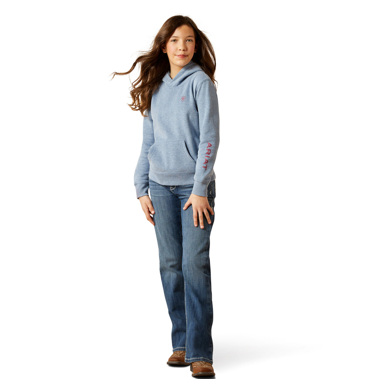 Person wearing a blue hoodie and jeans on a white background
