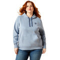 Woman wearing a gray hoodie with a logo on a white background