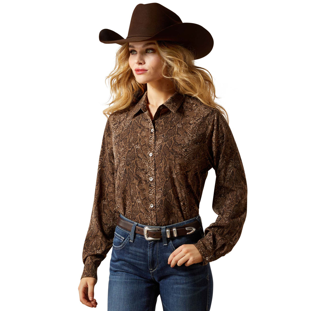Woman wearing a brown patterned shirt, blue jeans, and a brown cowboy hat on a white background