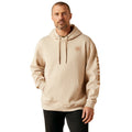 Man wearing a beige hoodie with a logo on a white background
