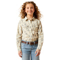 Young girl wearing a patterned shirt and jeans on a white background