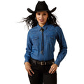 Woman wearing a blue denim shirt with a bolo tie and black cowboy hat on a white background