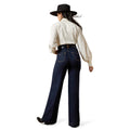 Person wearing a white shirt, dark blue jeans, and a black hat on a white background