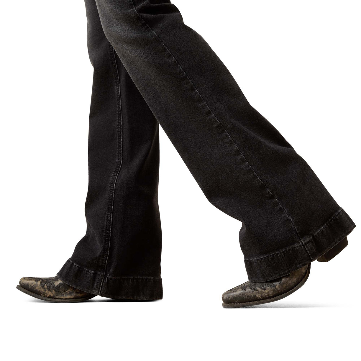 Black jeans and brown boots on a white background