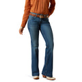 Woman wearing dark blue denim jeans, boot leg, mid rise, flare, cowgirl, casual, everyday jeans. 
