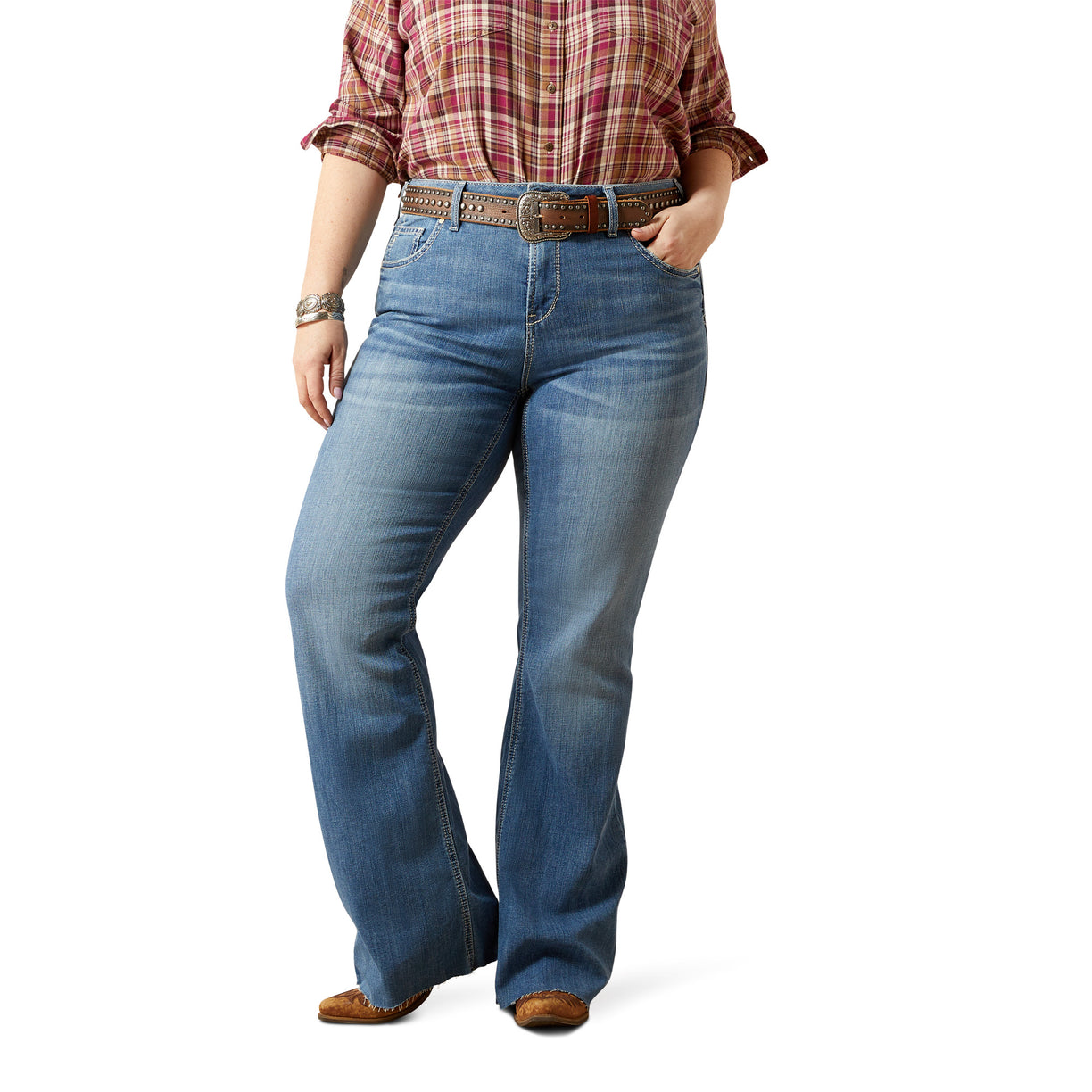Person wearing blue jeans and a plaid shirt on a white background
