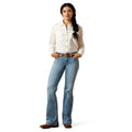 Woman wearing a white shirt and blue jeans on a white background