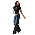 Woman wearing a black t-shirt and blue jeans on a white background