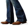 Blue jeans with brown shoes on a white background