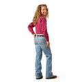 Young girl wearing a pink shirt and blue jeans on a white background