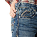 Close-up of blue jeans with a brand logo on a white background