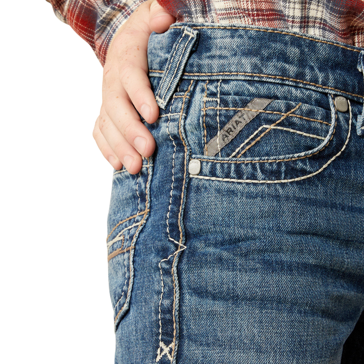 Close-up of blue jeans with a brand logo on a white background