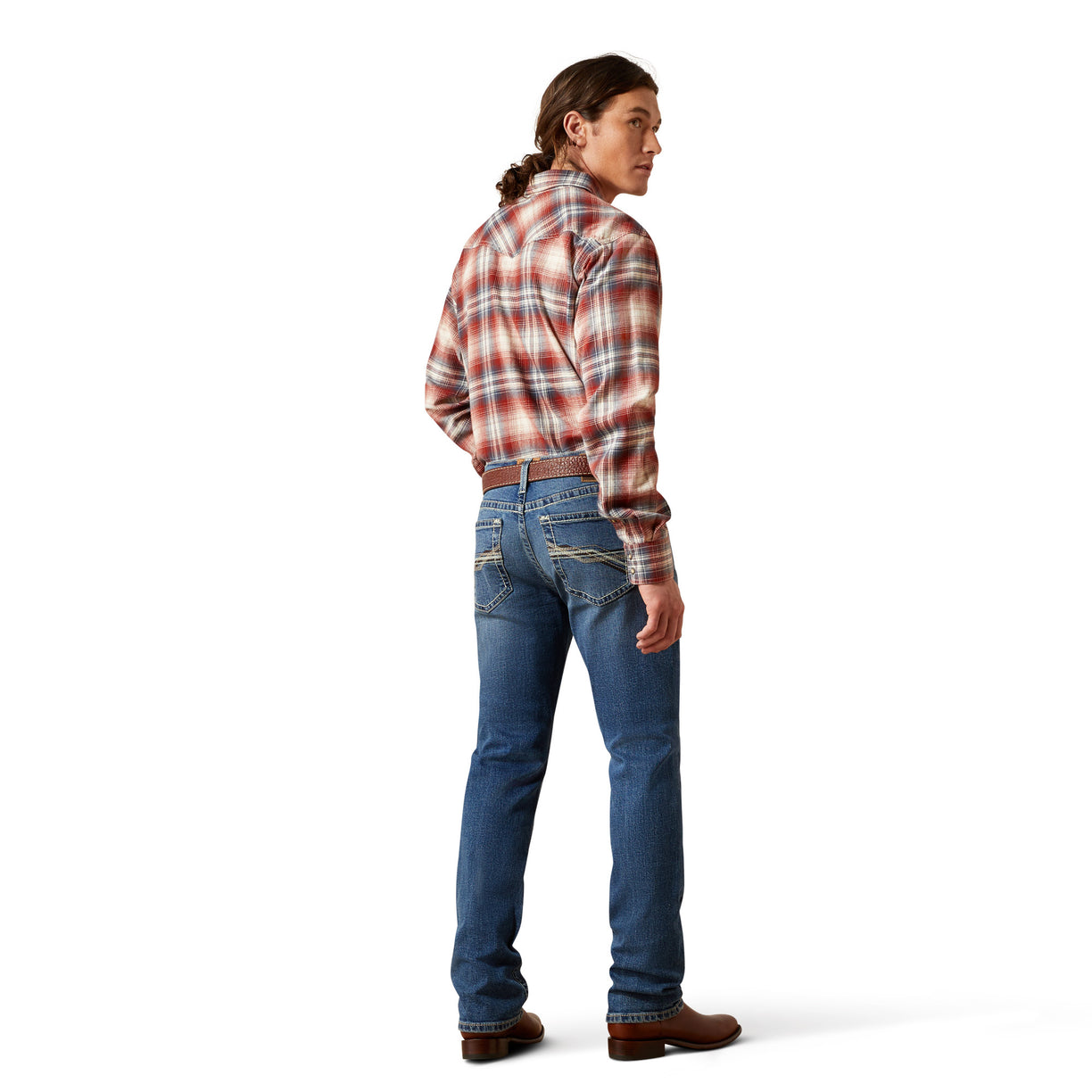Person wearing a plaid shirt and blue jeans on a white background