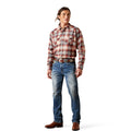 Man wearing a plaid shirt and jeans on a white background