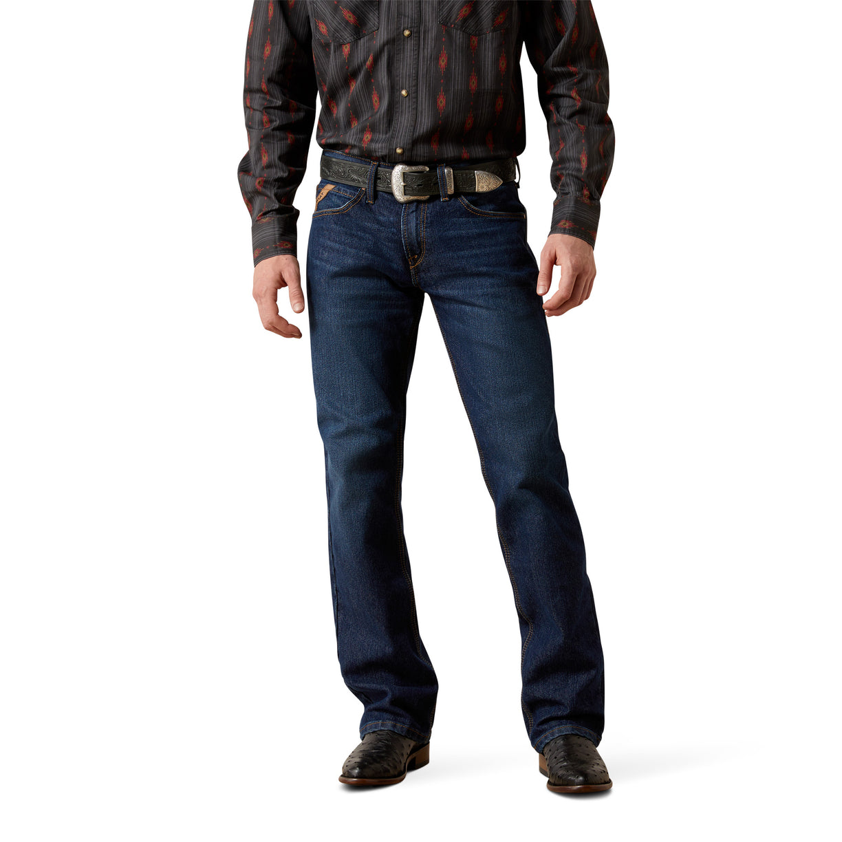Person wearing a patterned shirt, jeans, and brown shoes on a white background