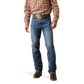 Person wearing blue jeans and a plaid shirt on a white background