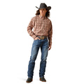 Man wearing a plaid shirt, jeans, and cowboy hat on a white background