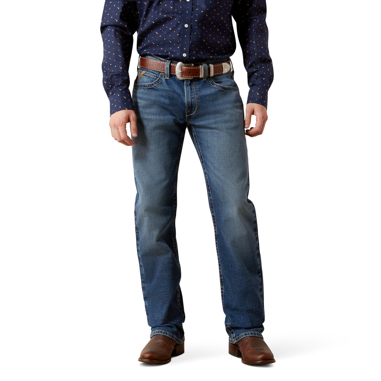 Person wearing a navy button-up shirt, indigo straight leg blue jeans, long leg and brown shoes on a white background