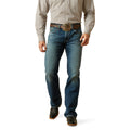Man wearing blue jeans and a plaid shirt on a white background