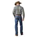 Man wearing a plaid shirt and jeans with a cowboy hat on a white background