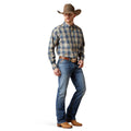 Man wearing a plaid shirt, jeans, and cowboy hat on a white background