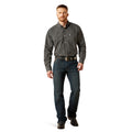 Man wearing a checkered shirt and jeans on a white background