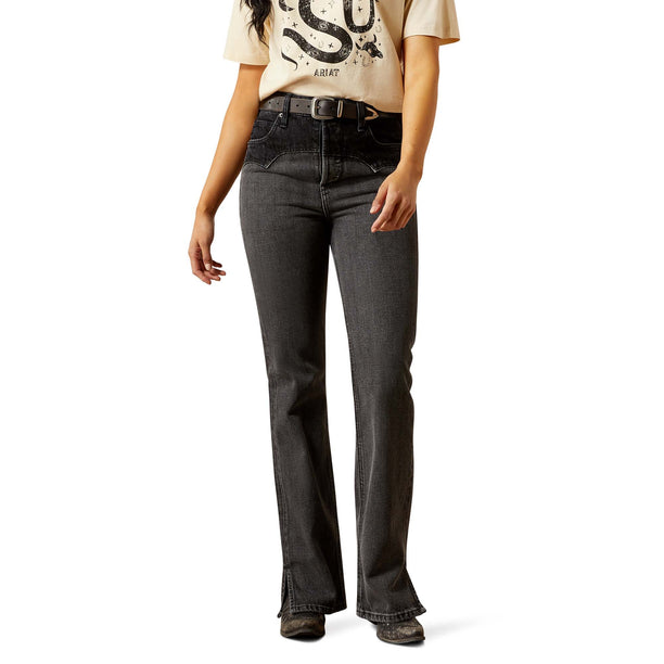 Person wearing black jeans on a white background