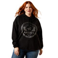 Woman wearing a black hoodie with Ariat logo on a white background