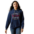Woman wearing a navy blue hoodie with branding on a white background