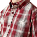 Close-up of a red and white plaid shirt with a brand logo on a white background