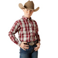 Child wearing a plaid shirt, jeans, and a cowboy hat on a white background