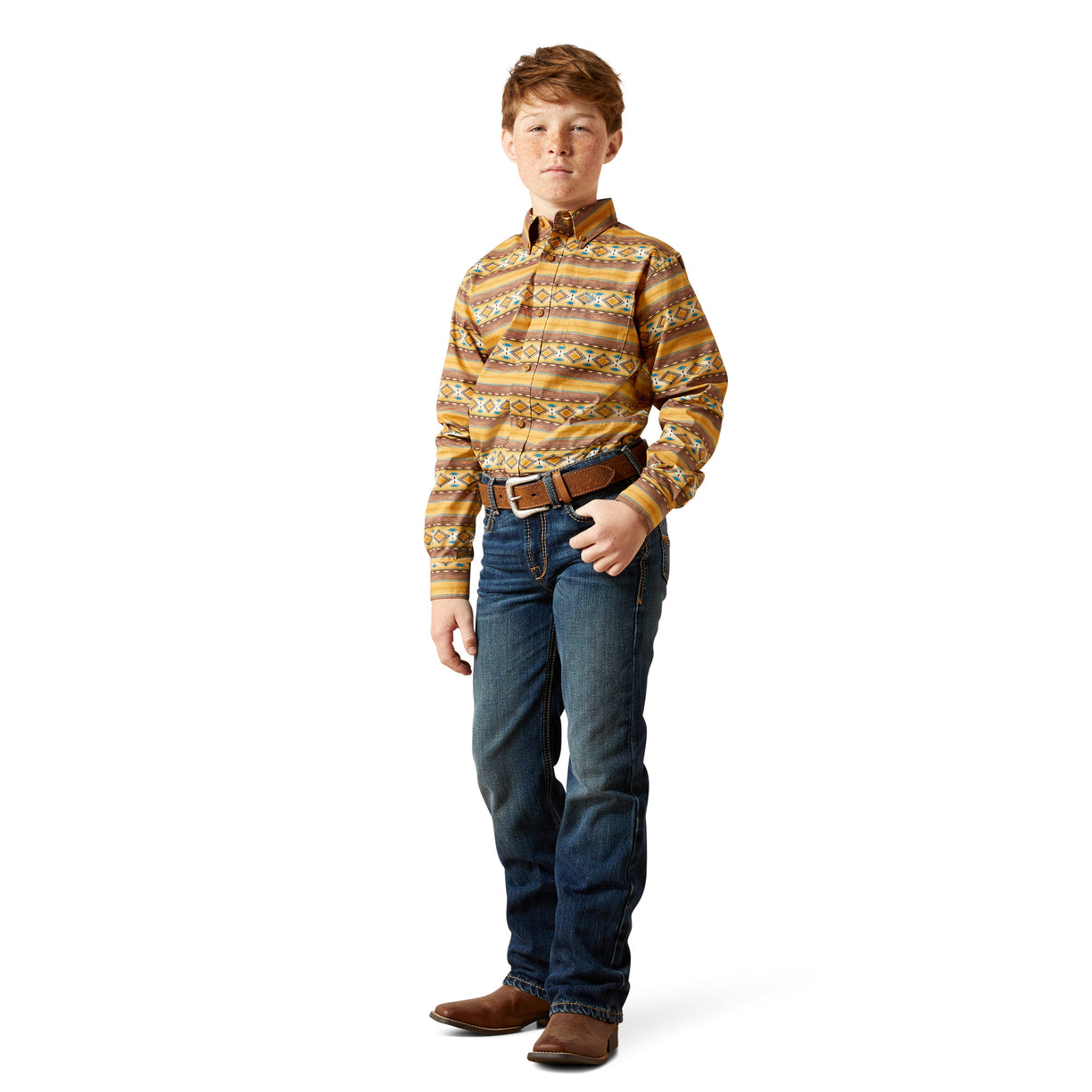Young boy wearing a patterned shirt and jeans on a white background