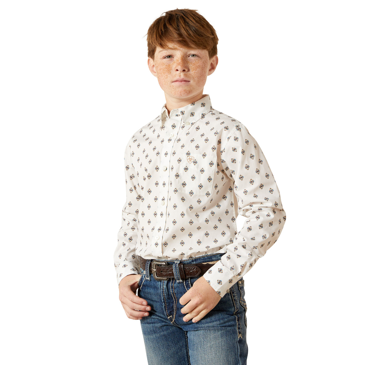 Young boy wearing a white patterned shirt and blue jeans on a white background