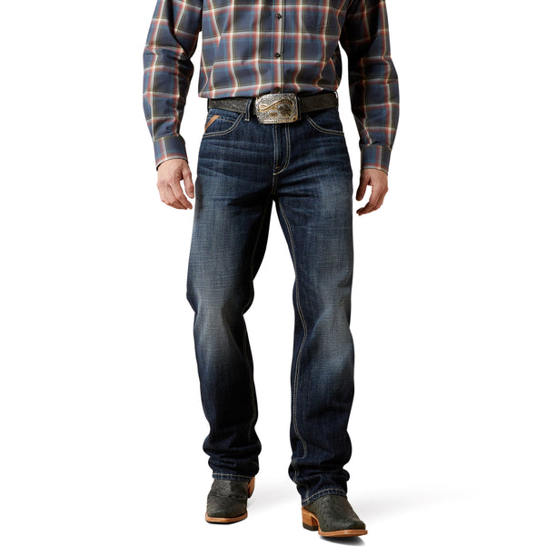 Person wearing a plaid shirt, straight leg jeans, and boots on a white background. Workwear, Cotton Denim, Dark blue wash indigo