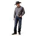 Man wearing a plaid shirt, jeans, and a cowboy hat on a white background
