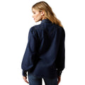 Woman wearing a dark blue denim shirt on a white background