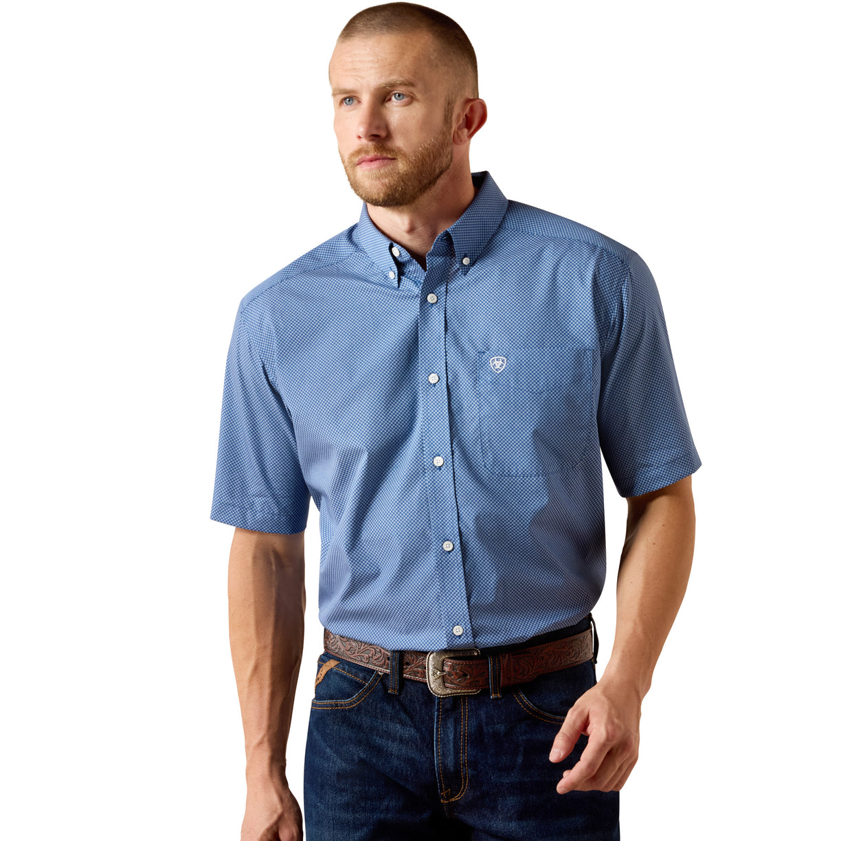 Blue micro-check short-sleeve shirt with chest pocket and logo detail - the Ariat Wrinkle Free Case Classic Fit Shirt, worn by a man with jeans