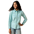 Woman wearing a light blue plaid shirt on a white background