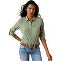 The VentTEK Shirt in sage green, long-sleeve with roll-tab cuffs and a zip chest pocket, styled with a western belt.