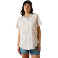 Off-white short-sleeve VentTEK Shirt with a small repeating floral print, styled with denim shorts and a cap.