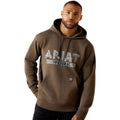 Man wearing a brown hoodie with 'Ariat Work' text on a white background