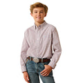 Young boy wearing a patterned shirt and jeans on a white background